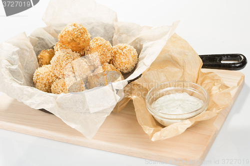 Image of Breaded potato balls with sauce