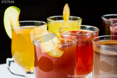 Image of mulled wine. fruit or berry drink. alcohol winter. against a dark background