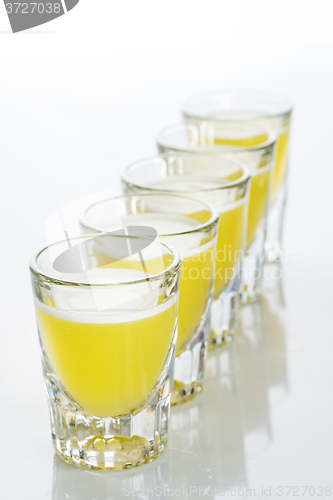 Image of Beautiful shot glasses back lit. yellow