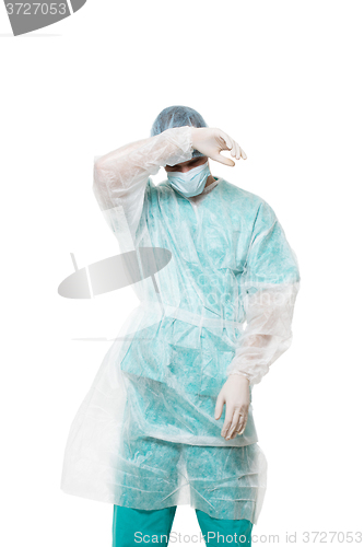 Image of Surgeon portrait. covered face with his hands. sad. isolated on white background