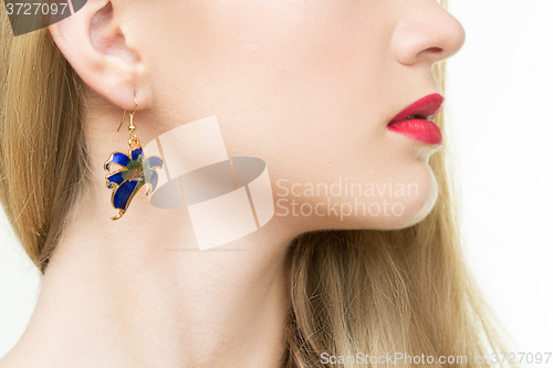 Image of close up of woman wearing shiny diamond earrings