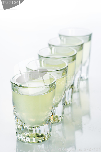 Image of Beautiful shot glasses back lit. yellow