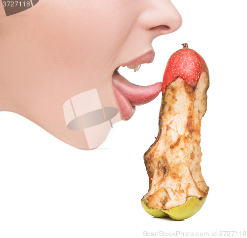 Image of girl touching tongue to bits of pear-like dildo