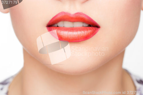 Image of Red Sexy Lips and Nails closeup. Open Mouth. Manicure and Makeup. Make up concept. 