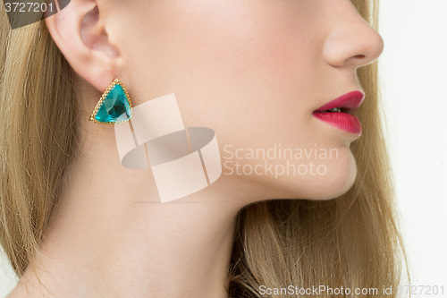 Image of close up of woman wearing shiny diamond earrings