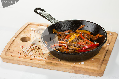 Image of Grilled pork. herbs in frying pan