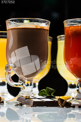 Image of mulled wine. fruit or berry drink. alcohol winter. against a dark background