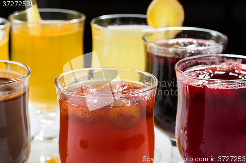 Image of mulled wine. fruit or berry drink. alcohol winter. against a dark background