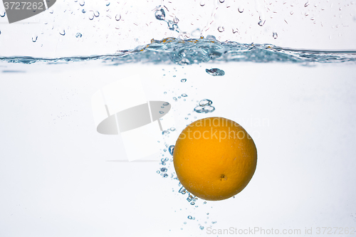 Image of orange splash in water 