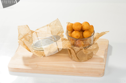 Image of Breaded potato balls with sauce