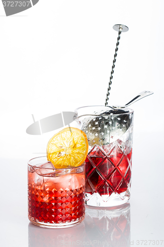 Image of Amber cocktail in a glass isolated on white background