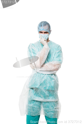 Image of Surgeon portrait. covered face with his hands. sad. isolated on white background