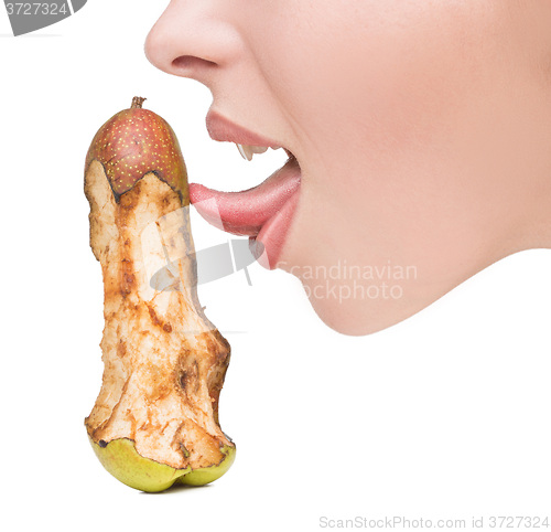 Image of girl touching tongue to bits of pear-like dildo