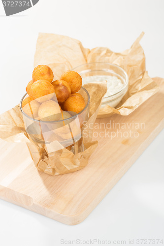 Image of Breaded potato balls with sauce