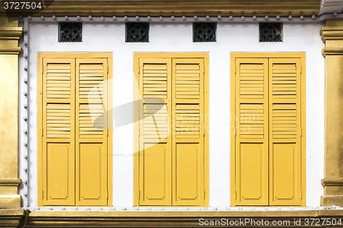 Image of yellow window doors