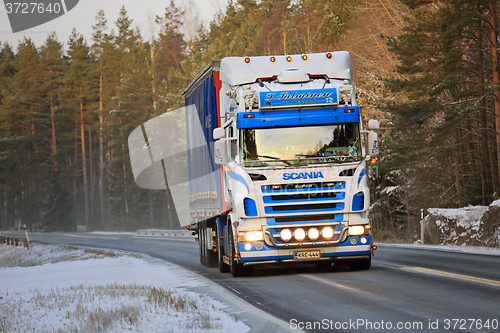 Image of Colorful Scania Semi Truck on Winter Road