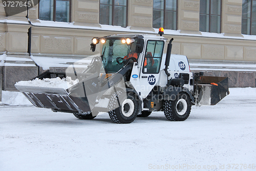 Image of Snow Removal Tractor in City
