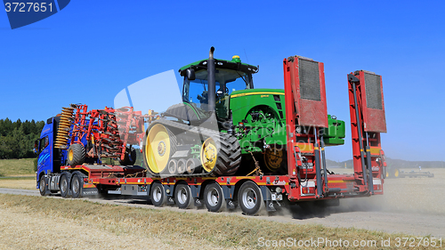 Image of Volvo FH Hauls John Deere Tractor