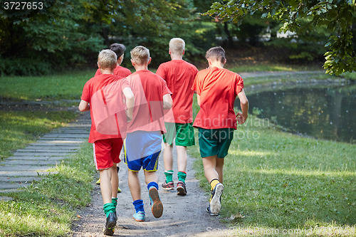 Image of Boys running in park