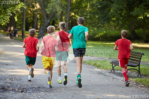 Image of Boys running in park