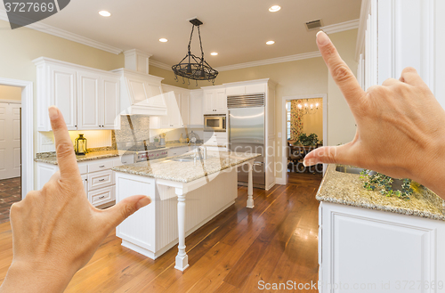 Image of Hands Framing A Beautiful Custom Kitchen