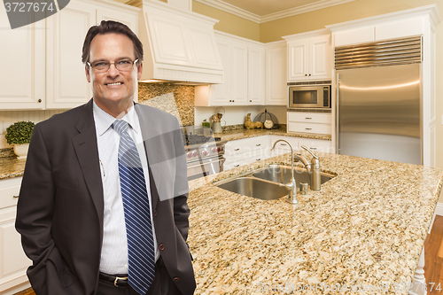 Image of Man Wearing Necktie in Beautiful Custom Residential Kitchen