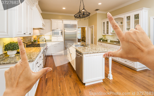 Image of Hands Framing A Beautiful Custom Kitchen