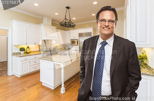 Image of Man Wearing Necktie in Beautiful Custom Residential Kitchen