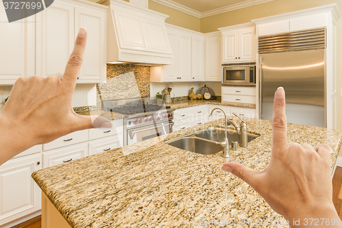 Image of Hands Framing A Beautiful Custom Kitchen