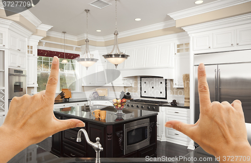 Image of Hands Framing A Beautiful Custom Kitchen