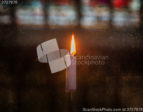 Image of Candle burning in church - Vintage dirty look