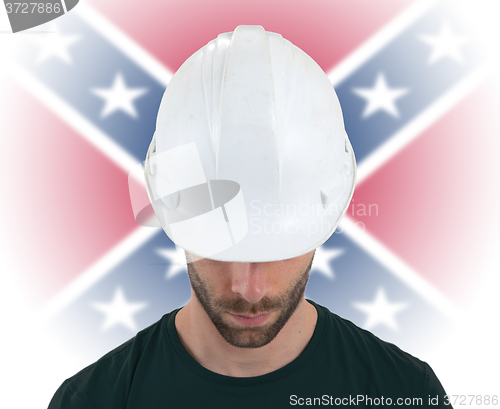 Image of Engineer with flag on background - Confederate flag