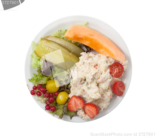 Image of Snack time - View of Russian salad on a white plate