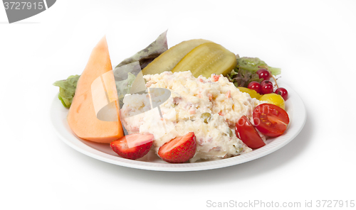 Image of Snack time - View of Russian salad on a white plate