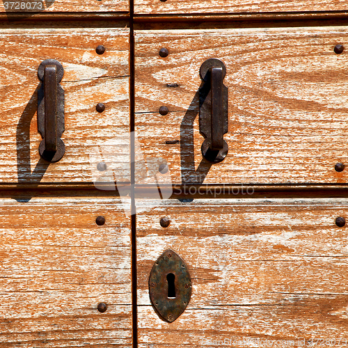 Image of door in italy old ancian wood and trasditional  texture nail