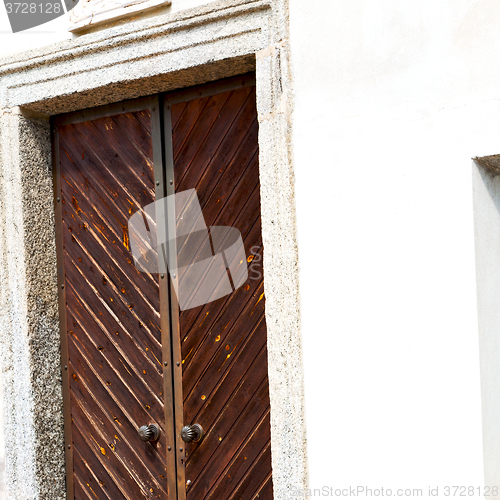 Image of detail in  wall door  italy land europe architecture and wood th