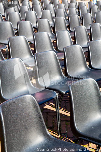 Image of empty seat in  background black  texture