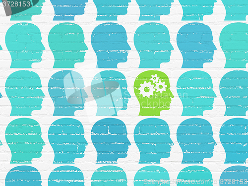 Image of Learning concept: head with gears icon on wall background