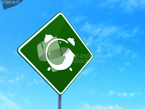 Image of Time concept: Alarm Clock on road sign background