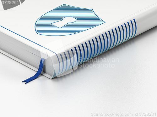 Image of Security concept: closed book, Shield With Keyhole on white background