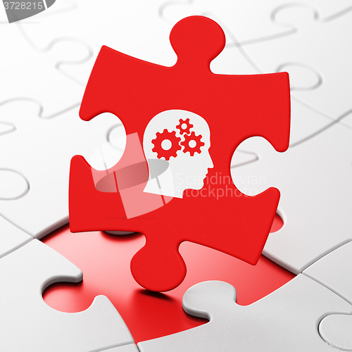 Image of Advertising concept: Head With Gears on puzzle background