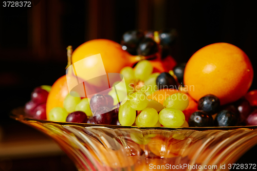 Image of Assortment of juicy fruits on wooden table,