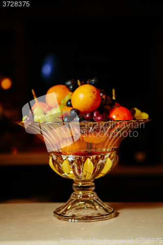 Image of Assortment of juicy fruits on wooden table,