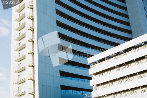 Image of angle view to textured background of modern glass building 