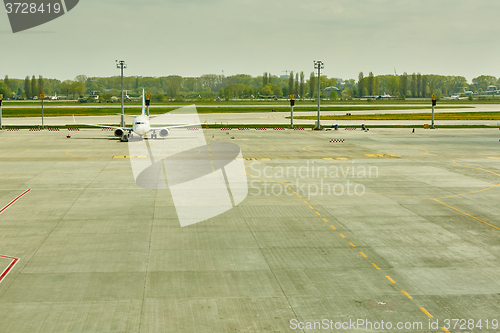 Image of Airplane at the terminal gate ready for takeoff 