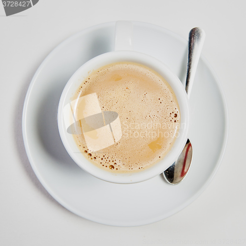 Image of cup of fresh espresso on table,