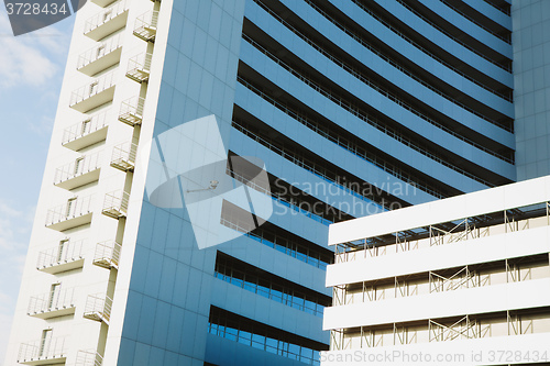 Image of angle view to textured background of modern glass building 