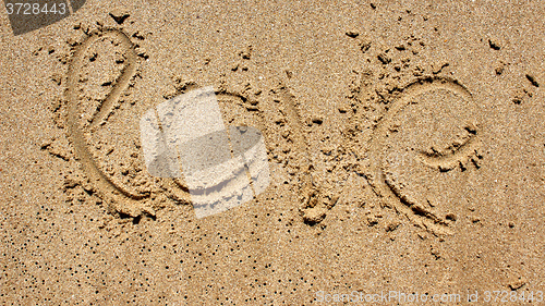 Image of love message written in sand