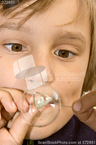 Image of boy blowing bubbles