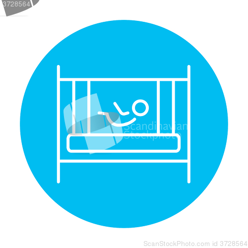 Image of Baby laying in crib line icon.